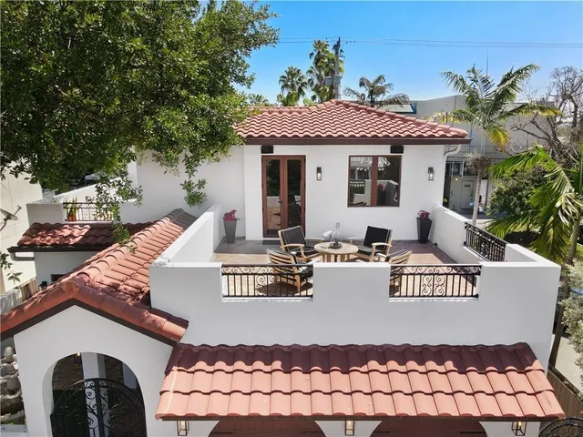 a bedroom with a bed and a table