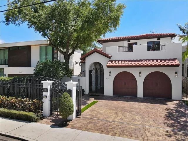 a sign that is on the wall of a house