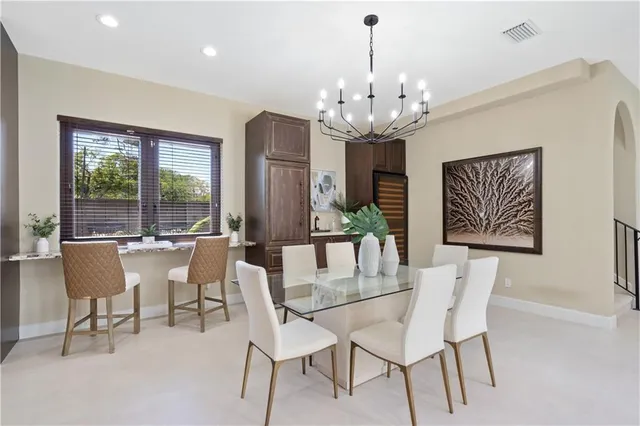a view of a dining room with furniture window and outside view