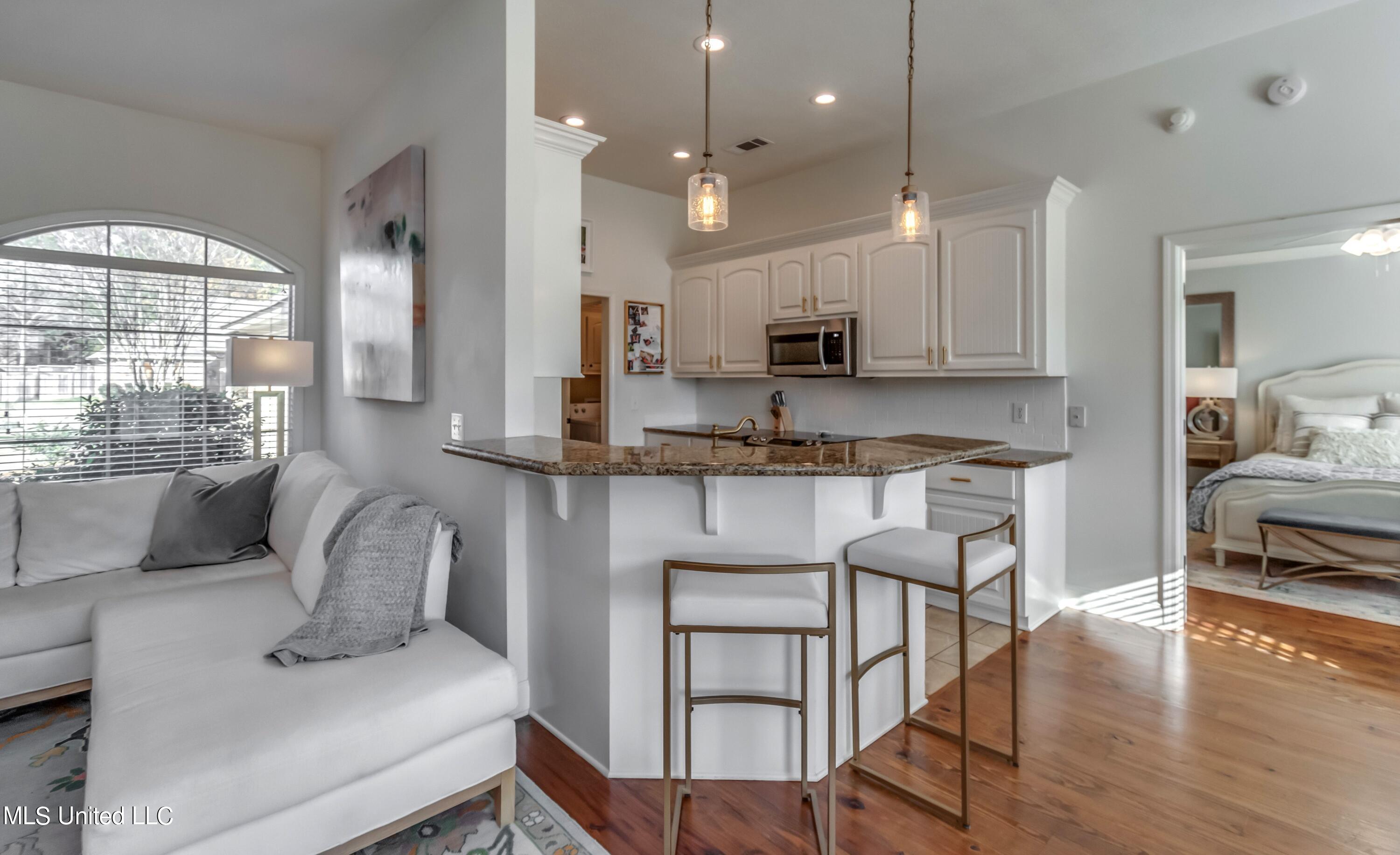 208 Memory Lane Madison, MS 39110 - Photo 12 of 41 White cabinets with white stone backspla