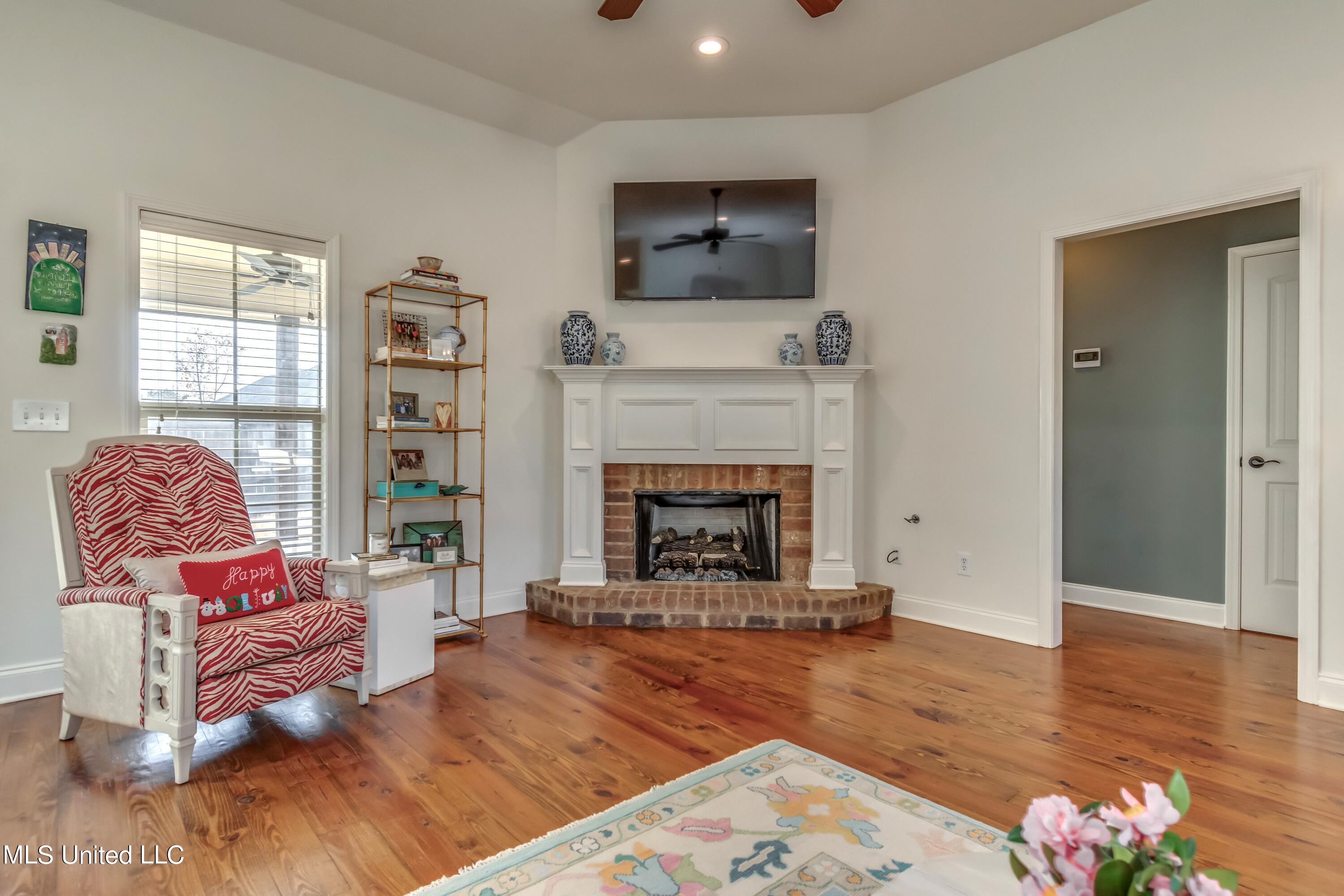208 Memory Lane Madison, MS 39110 - Photo 9 of 41 Fireplace with brick surround and raised