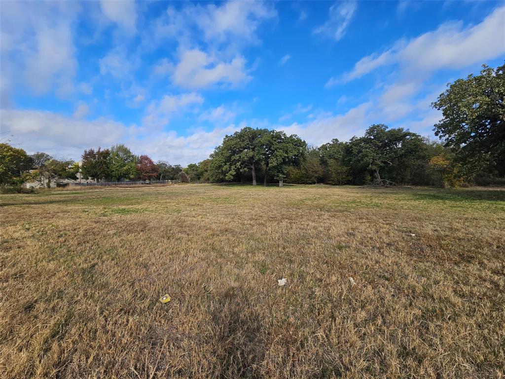 7609 John T White Road Fort Worth, TX 76120 - Photo 4 of 4 View of green lawn featuring a view of rural / pastoral area