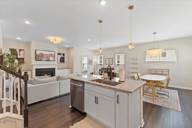 a kitchen with sink cabinets and wooden floor