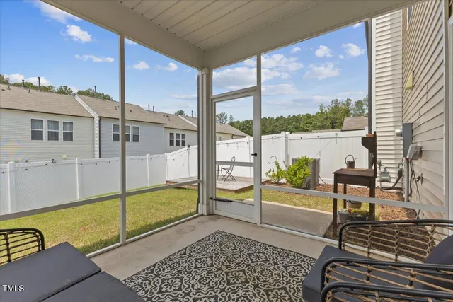 a wooden bench sitting in front of a window