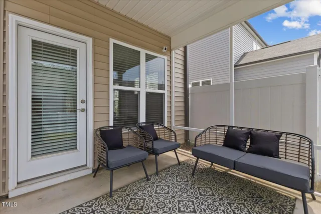 a view of a house with a yard and porch