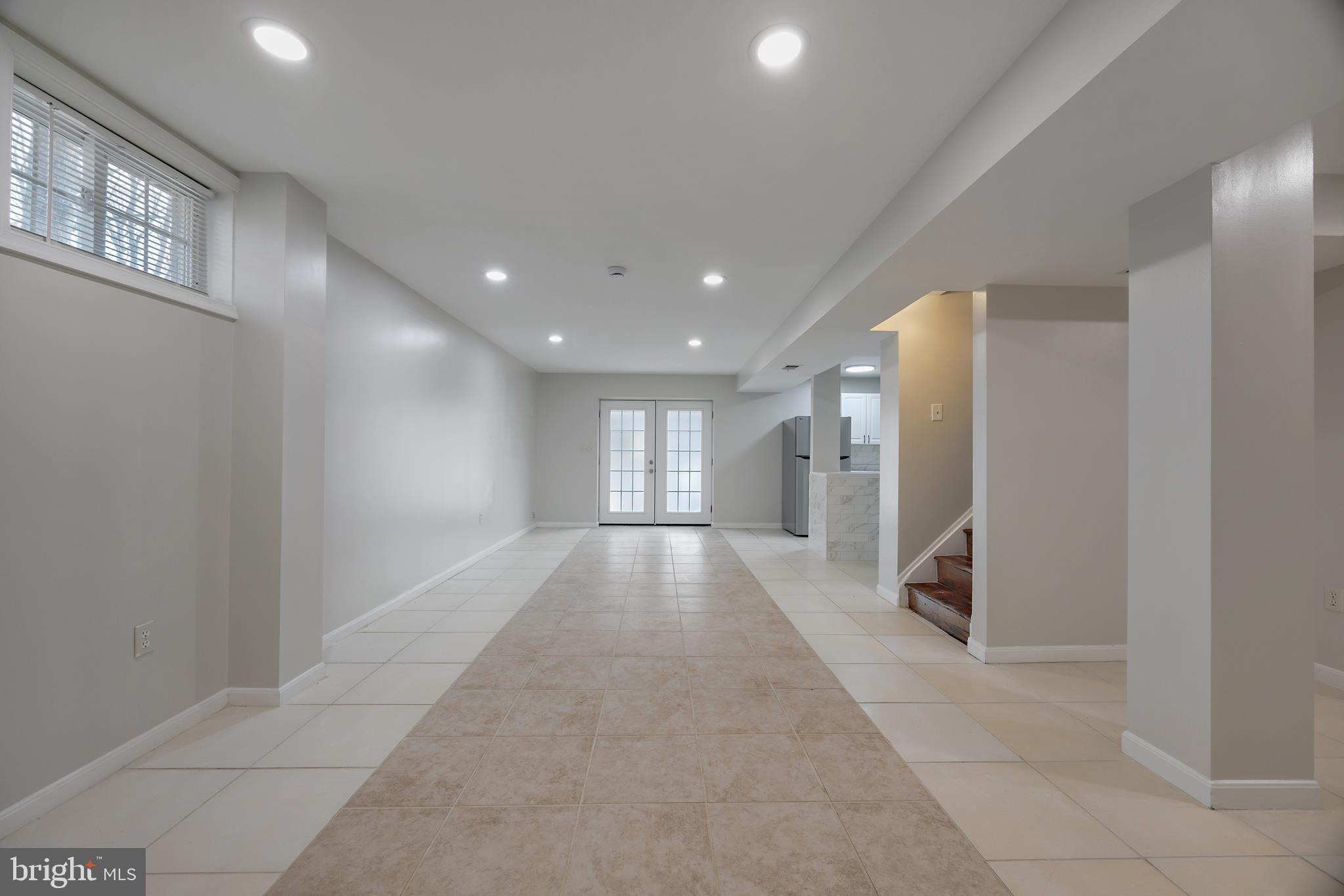 16729 Queen Anne Road Upper Marlboro, MD 20774 - Photo 11 of 29 a view of hallway with a couch and a window
