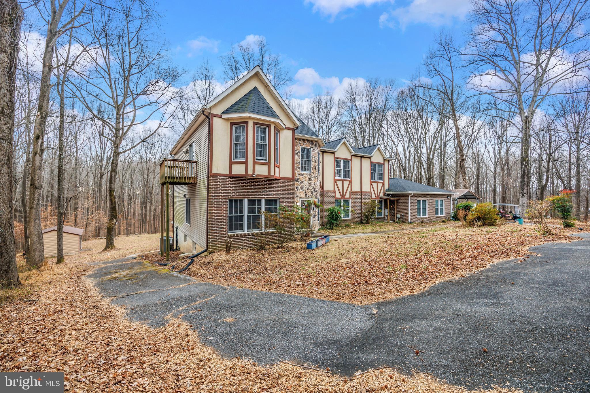 16729 Queen Anne Road Upper Marlboro, MD 20774 - Photo 2 of 29 a front view of a house with a yard