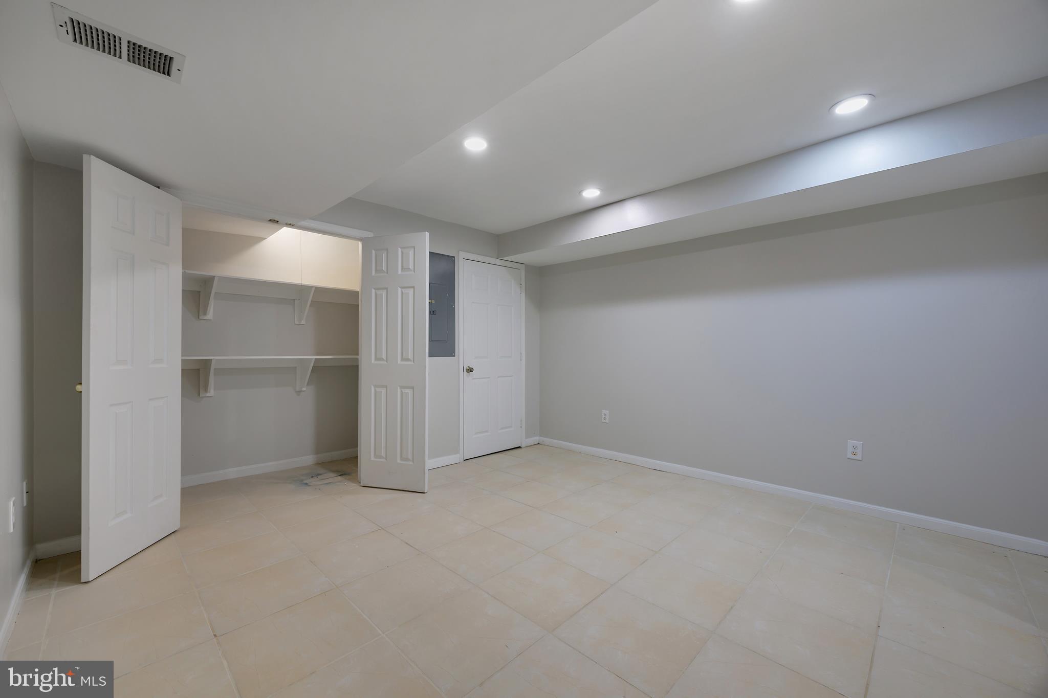 16729 Queen Anne Road Upper Marlboro, MD 20774 - Photo 22 of 29 an empty room with a empty space and windows