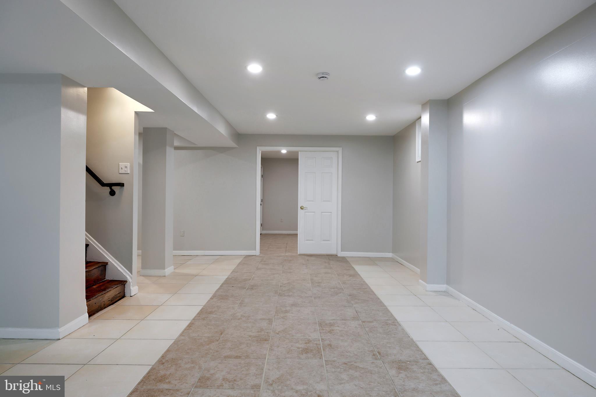 16729 Queen Anne Road Upper Marlboro, MD 20774 - Photo 7 of 29 a view of hallway with a large window and a projector screen