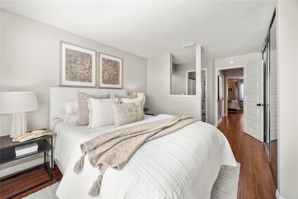 a bed room with a bed and a night stand