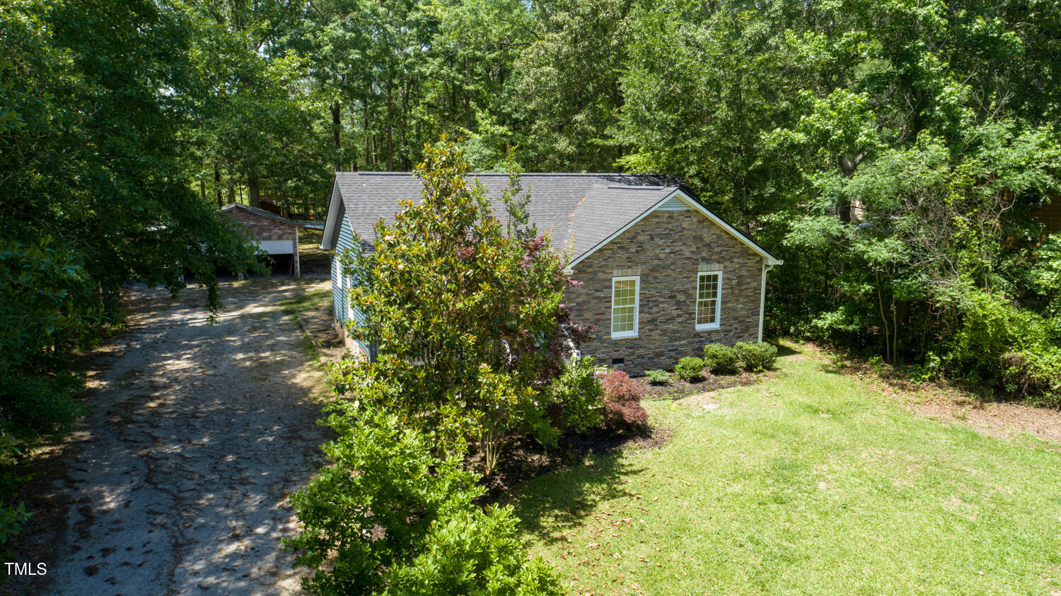 856 Williams-White Road Zebulon, NC 27597 - Photo 1 of 38 a front view of a house with a yard and garage