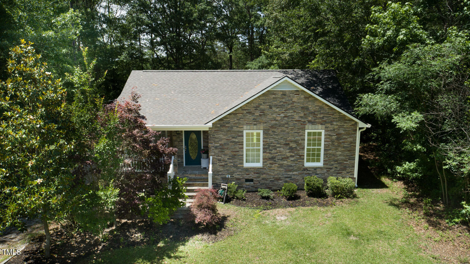 856 Williams-White Road Zebulon, NC 27597 - Photo 22 of 38 a view of a house with backyard and garden