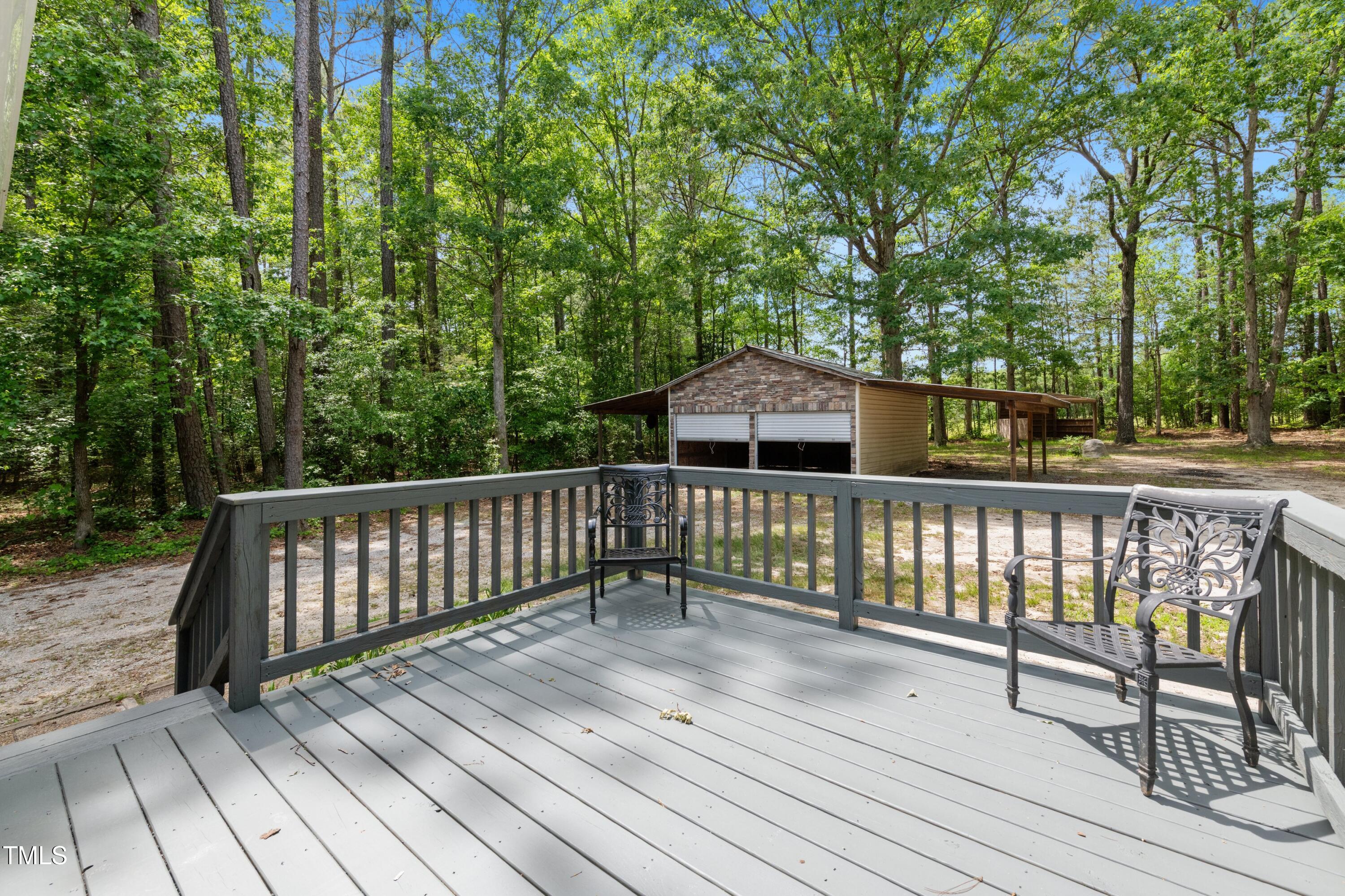 856 Williams-White Road Zebulon, NC 27597 - Photo 23 of 38 a view of a wooden roof deck