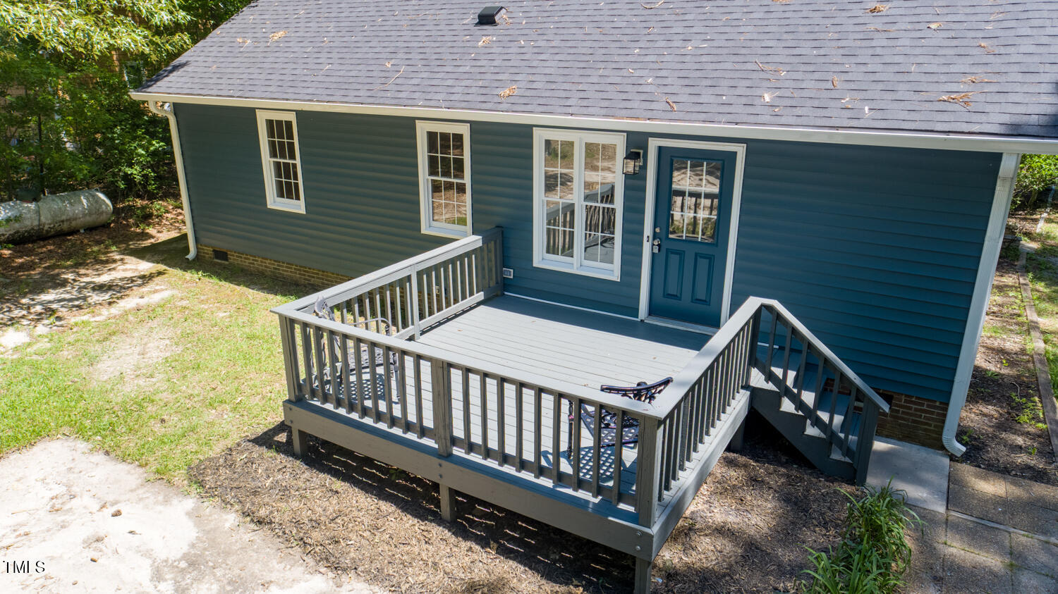 856 Williams-White Road Zebulon, NC 27597 - Photo 26 of 38 a view of a house with wooden deck and furniture