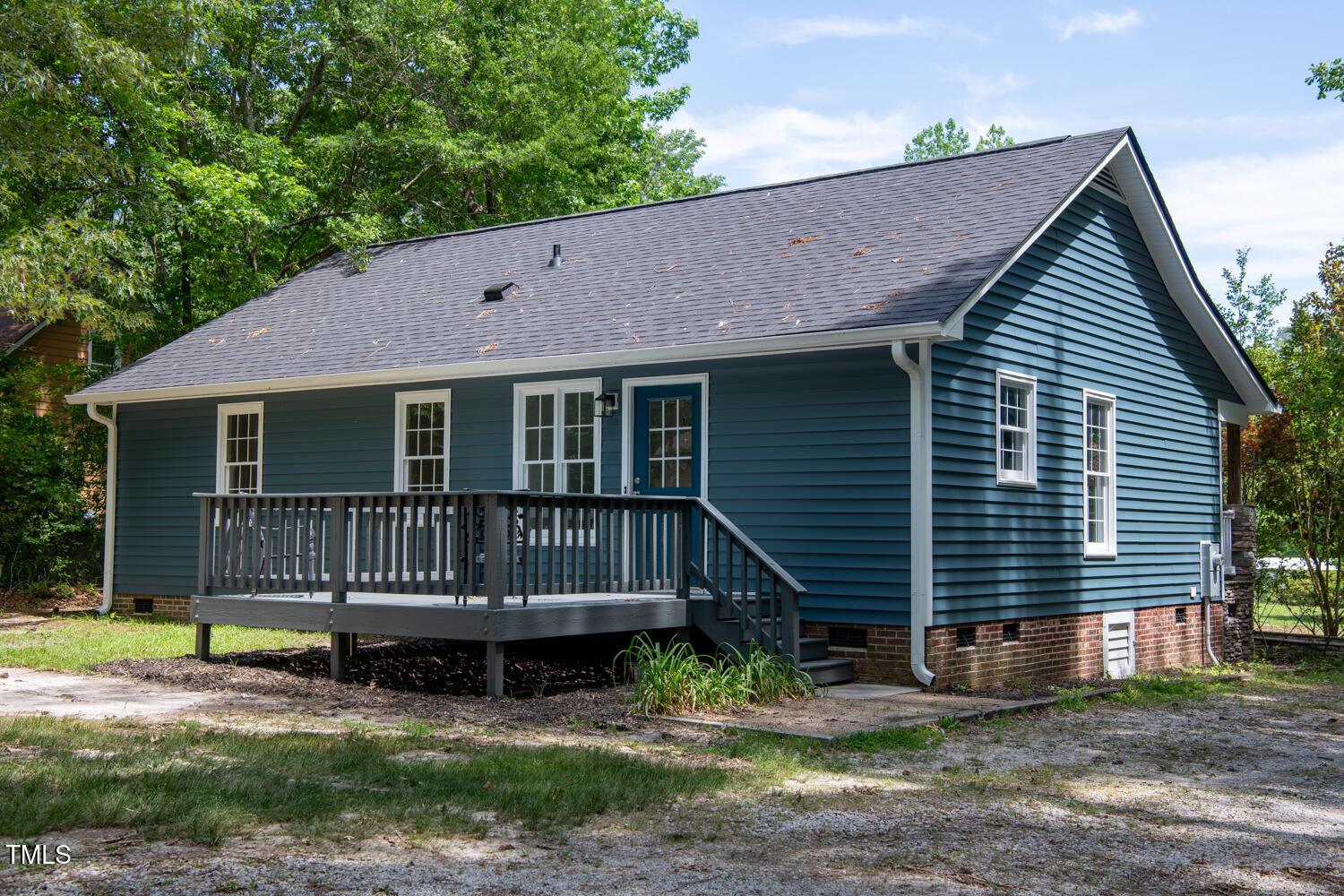 856 Williams-White Road Zebulon, NC 27597 - Photo 27 of 38 a view of a house with a yard and wooden fence