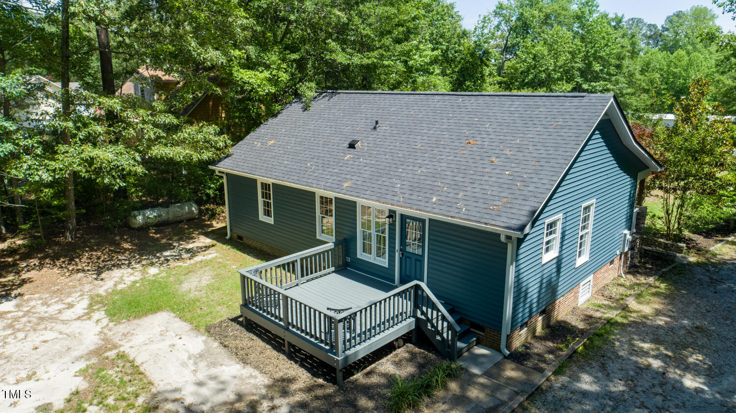 856 Williams-White Road Zebulon, NC 27597 - Photo 33 of 38 a view of house with backyard and trees