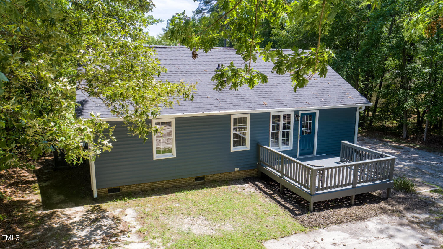 856 Williams-White Road Zebulon, NC 27597 - Photo 35 of 38 a view of a house with a yard and deck