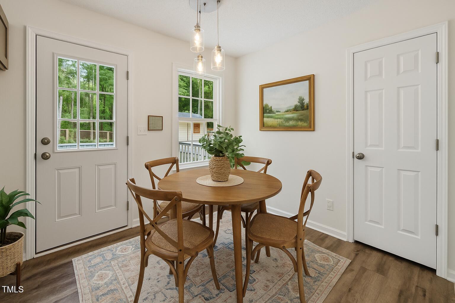 856 Williams-White Road Zebulon, NC 27597 - Photo 8 of 38 a view of a dining room with furniture window and wooden floor
