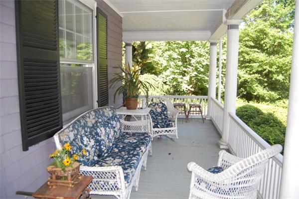 25 Winthrop Road Lexington, MA 02421 - Photo 3 of 16 a balcony with chairs and a table