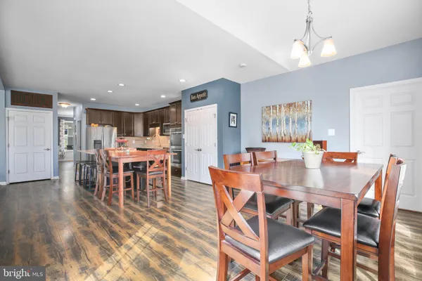 a living room with furniture a table and a fireplace