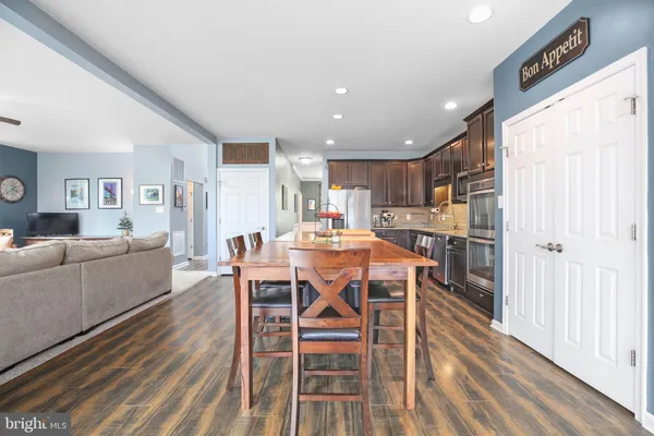 a bedroom with furniture and a flat screen tv