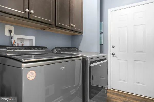 a bedroom with furniture and a book shelf