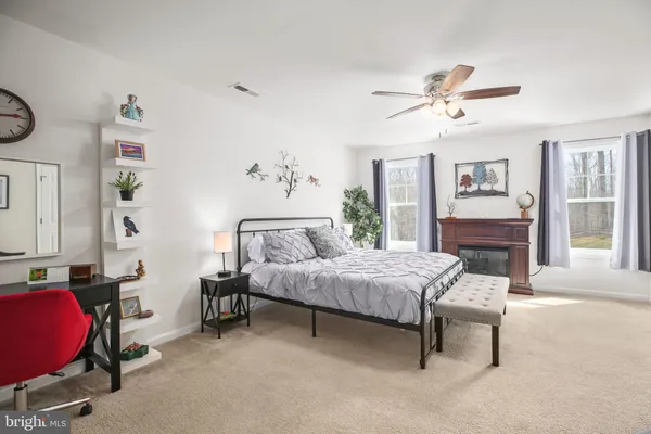 a bathroom with a toilet a sink and a mirror