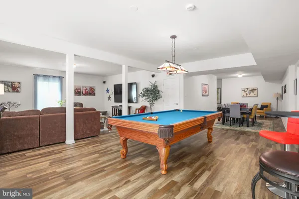 a bathroom with a sink a toilet and shower curtain