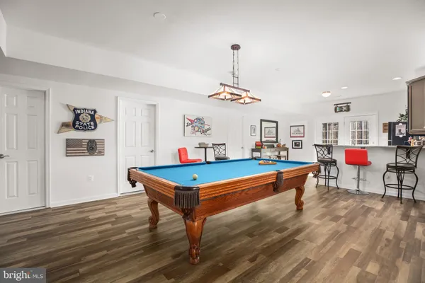 a view of a chair and tables front of the house