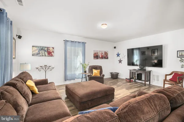 a view of a patio with couple of chairs