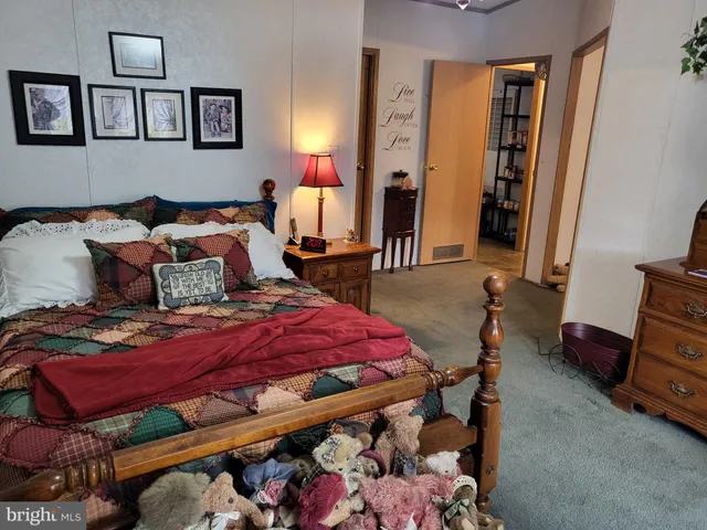 a living room with lots of furniture and a chandelier