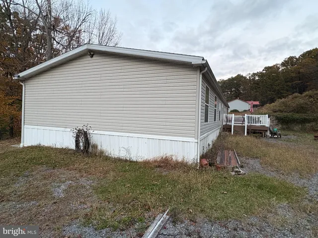 a view of balcony with wooden floor and fence