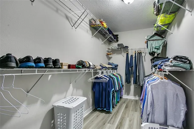 a room with gym equipment and a flat screen tv