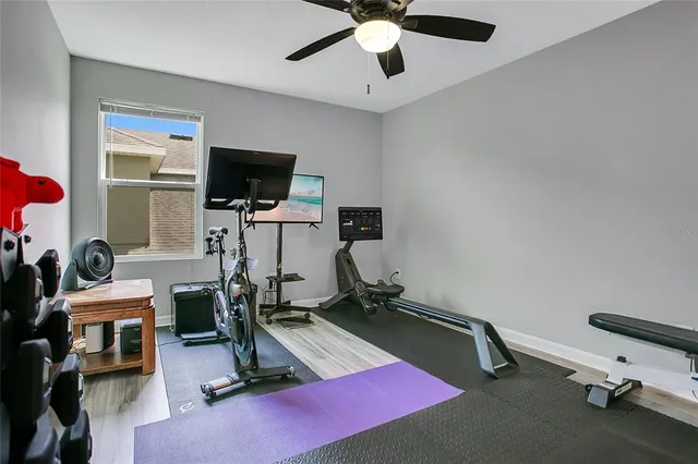 a bathroom with a granite countertop sink toilet mirror and a shower