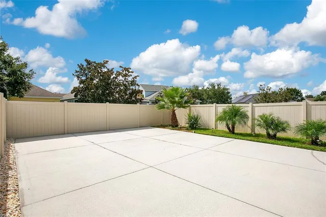 a front view of a house with a yard and a garage