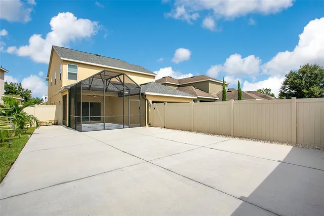 a view of a backyard of the house
