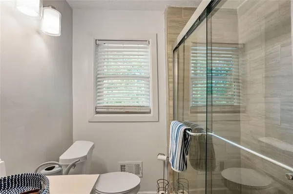 a bathroom with a toilet and a sink