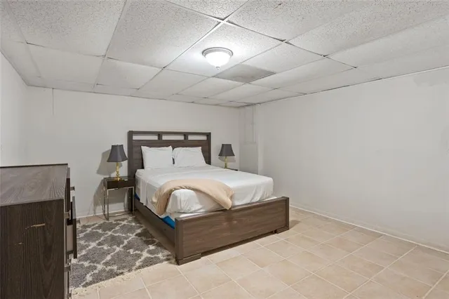 a bedroom with a bed and a fireplace