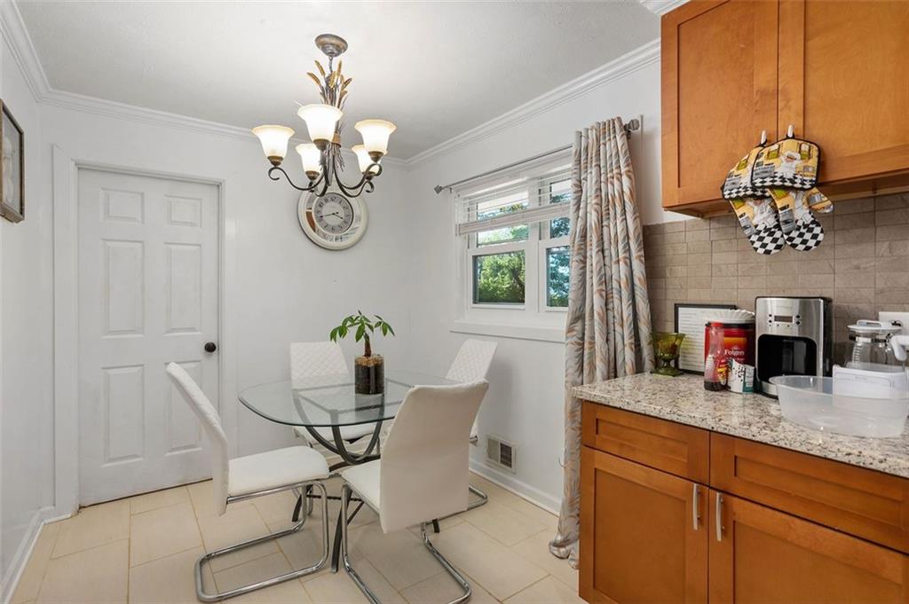 3501 Wesley Chapel Road Decatur, GA 30034 - Photo 5 of 20 a dining room with table chairs and a chandelier
