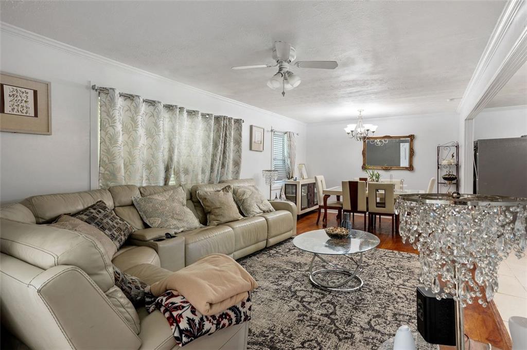 3501 Wesley Chapel Road Decatur, GA 30034 - Photo 7 of 20 a living room with furniture a couch and a flat screen tv