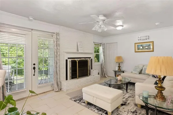 a living room with furniture and a fireplace