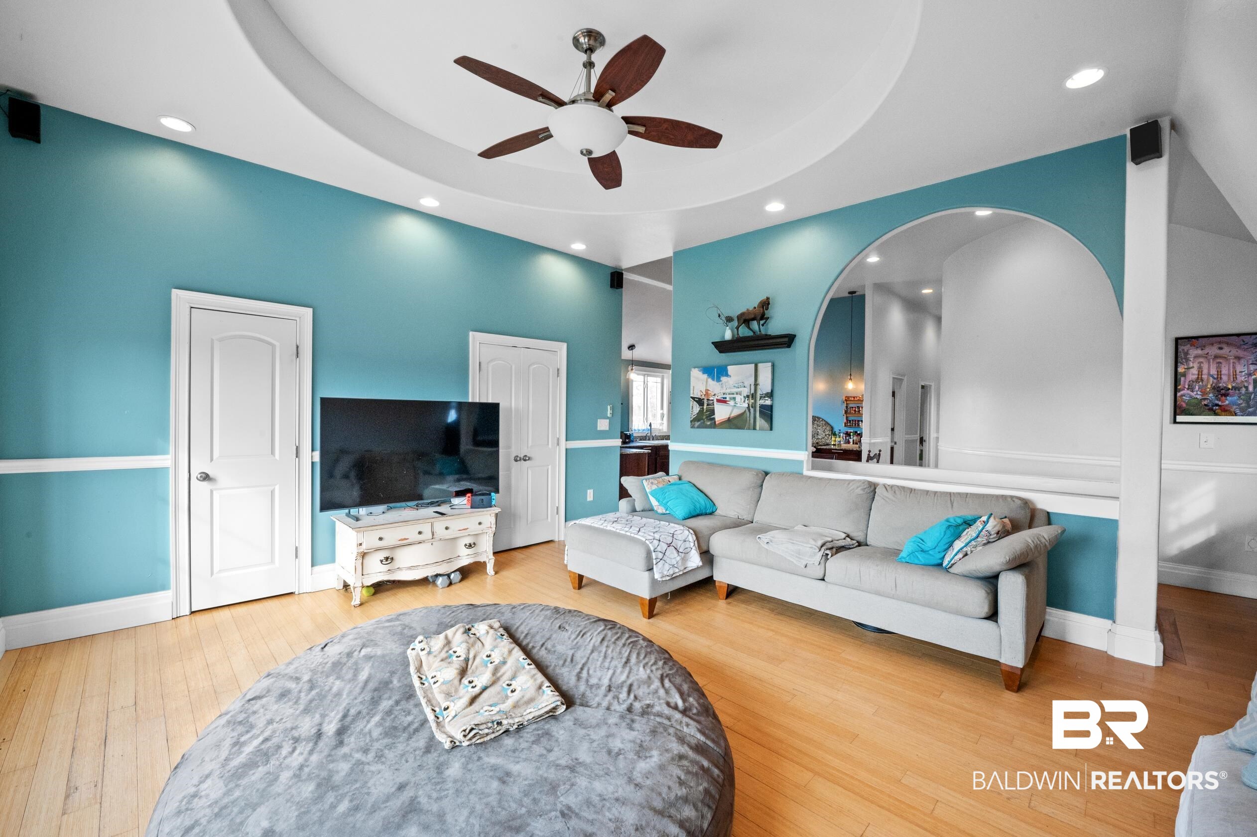 13358 County Road 91 Elberta, AL 36530 - Photo 5 of 47 Living room with hardwood / wood-style flooring, ceiling fan, and a tray ceiling