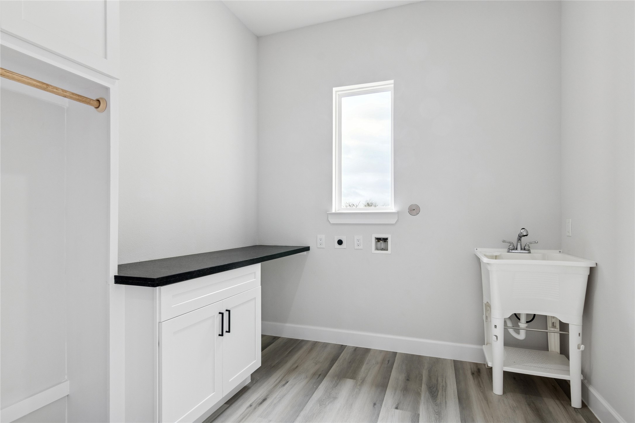5766 Ward Bend Road Sealy, TX 77474 - Photo 26 of 45 a utility room with wooden floor washer and dryer