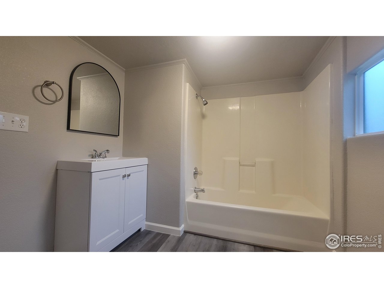 109 4th Street Gilcrest, CO 80623 - Photo 11 of 22 a bathroom with a sink and a mirror