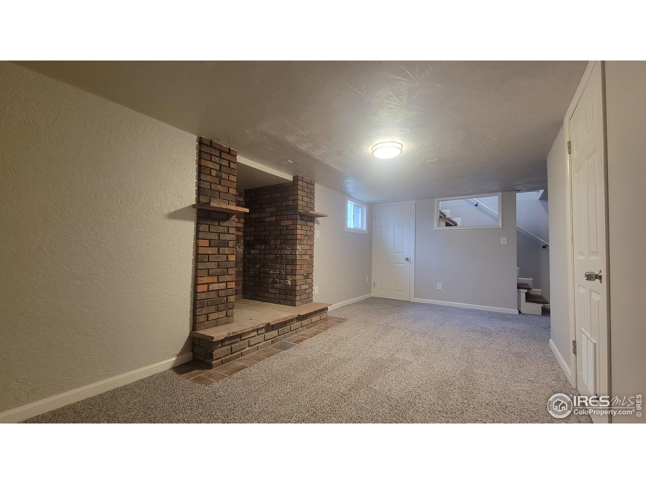 109 4th Street Gilcrest, CO 80623 - Photo 13 of 22 a open hall with a bench