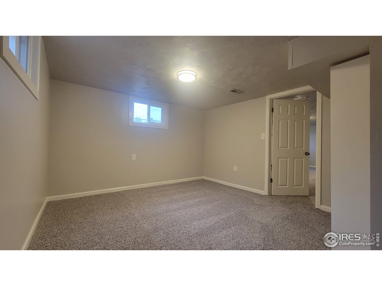 109 4th Street Gilcrest, CO 80623 - Photo 14 of 22 a open hall with stairs