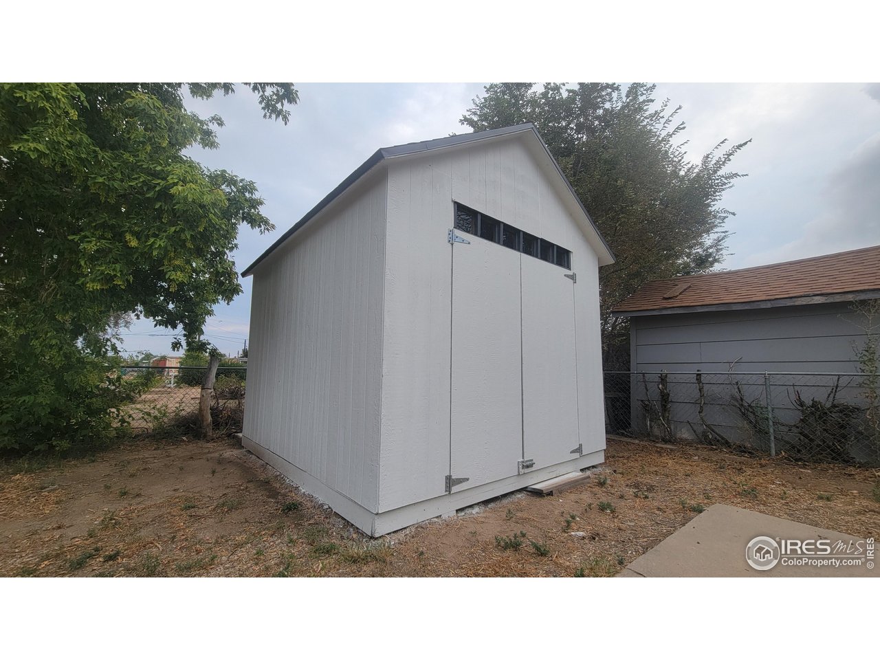 109 4th Street Gilcrest, CO 80623 - Photo 21 of 22 a black and white photo of a house