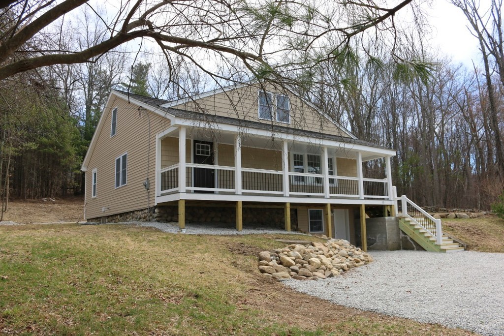 181 Westboro Road Upton, MA 01568 - Photo 1 of 15 a house with trees in the background