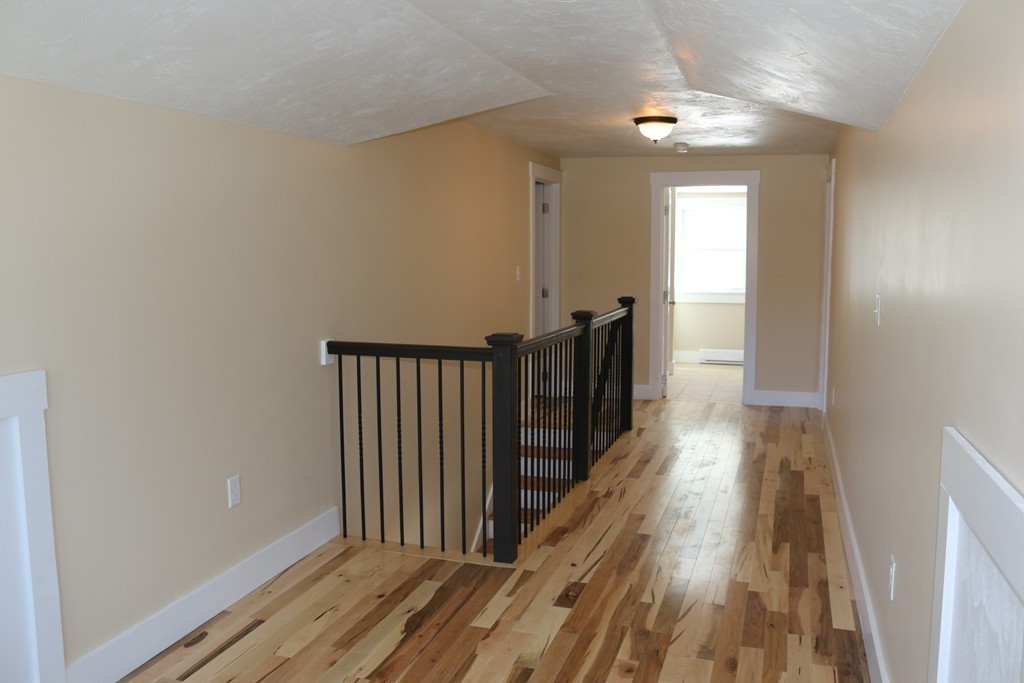 181 Westboro Road Upton, MA 01568 - Photo 12 of 15 a view of a hallway with wooden floor