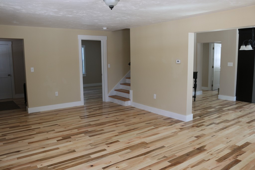181 Westboro Road Upton, MA 01568 - Photo 14 of 15 a view of a room with wooden floor and staircase